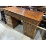 An early 20th century pedestal desk. A.f missing plinth and handles. W:137cm x D:61cm x H:82cm