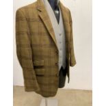 A mens checked tweed jacket By Roderick Charles, a grey wool waistcoat by Belvoir with fox head