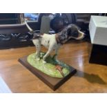 A Royal Doulton pointer on plinth with original box. Serial number RDA15. From the gun dog