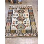 Large modern lounge rug in Kilim. Good condition. W:175.5cm x D:0.5cm x H:240cm