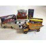 A Meccano model of a tipper truck together with a Scalextric boxed car, a Yardley Mc Laren M19-F1