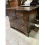 A small late 19th early 20th century mahogany chest of drawers with two small over two long drawers.