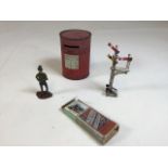 A Macfarlane biscuit tin style as a Post box, a Crescent railway signal, a painted lead figure and
