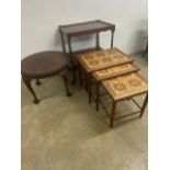 A Danish mid century tiled top nest of tables a circular table also with a two tier table.