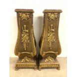 A Pair of modern gilt embossed columns or jardiniere stands with marble tops. W:50cm x D:47cm x H: