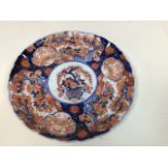 A blue and white pottery plate with Fisherman and castle pattern - impressed asterix to base W: