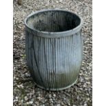 A large barrel shaped galvanised planter. W:46cm x D:46cm x H:56cm