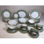 A vintage Chinastyle Simpsons (potters) green and gilded dinner service. Comprising 8 soup bowls and