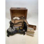 A Jones Serpentine Hand sewing machine in original box with instruction booklet