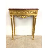 A modern decorative gilt and marble hall table. W:76cm x D:28cm x H:99cm