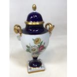 A vintage Kaiser German porcelain lidded floral urn with Rams head handles W:18cm x H:33cm