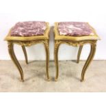 A pair of modern gilt side tables with bevelled marble top.