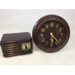 A Bakelite clock labelled Gents, Exeter and a radio. A/F