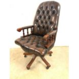 A good quality leather button back and seated swivel office chair. H:49cm