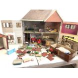 A mid century dolls house also with a large quantity of plastic furniture including a Floral