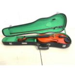 A violin in case. With label Skylark brand Republic of china.