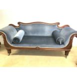 A Victorian Biedermeier style scroll arm sofa with curved back rest on wide turned legs with brass