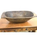 An antique dough bowl. (a.f signs of treated woodworm) W:75cm x D:43cm x H:21cm