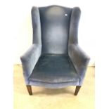 A Blue velour early 20th century wing back arm chair. H:33cm
