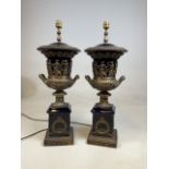 a pair of ceramic and bronzed metal table lamps styled as Grecian urns on plinths H:62cm