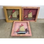 Three framed model ship dioramas in pine box frames. W:50cm x D:50cm x H:6cm