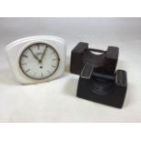 A .pair of very heavy cast iron Bristol weights together with a vintage Garant clock