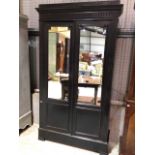 An aesthetic style black painted wall cupboard with mirrored doors and internal shelves. W:125cm x