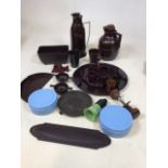 A quantity of Bakelite items including egg cups on stand, a knife sharpener, thermos jugs, blue