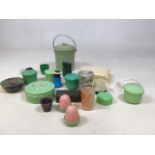 A quantity of green and cream Bakelite items