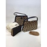 A two leopard skin bags, a fur muff, a kangaroo purse and a handbag fitted with Stratton compacts