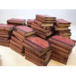 A set of sixty nine half leather bound books with marbles covers from Sir John Lubbocks Hundred