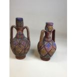 A near pair of hand thrown and decorated antique pottery amphoras. Restoration to top of one W: