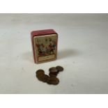 A tin plate money box with pennies W:9.5cm x D:6cm x H:12cm