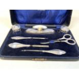 A silver topped and handled ladies vanity set in fitted case.