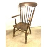 A late 19th early 20th century elm seated kitchen stick back arm chair. A.F Loose arm. W:58cm x D: