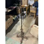 A wrought iron standard lamp. H:145cm