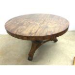 A large Victorian circular rosewood breakfast table on tripod base with scroll feet and large