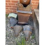 A Clay chimney pot also with four metal hoppers.