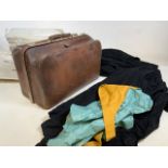 An antique leather Gladstone bag also with University robes and colours by Ede Ravenscroft ltd.