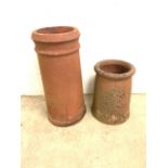 Two terracotta chimneys or planters. H:39cm and 62cm.