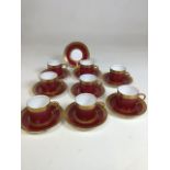 Eight Royal Worcester coffee cans In Red Diana colour way with additional saucer. Hairline to one