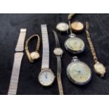 A Longines watch also with collection of other watches.