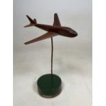 A wooden model of a Boeing 747 jumbo jet - signed Peter Wade to base H:38cm