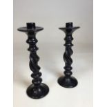 Pair of mid-century, soap stone, twisted black candlesticks possibly soap stone H:31cm