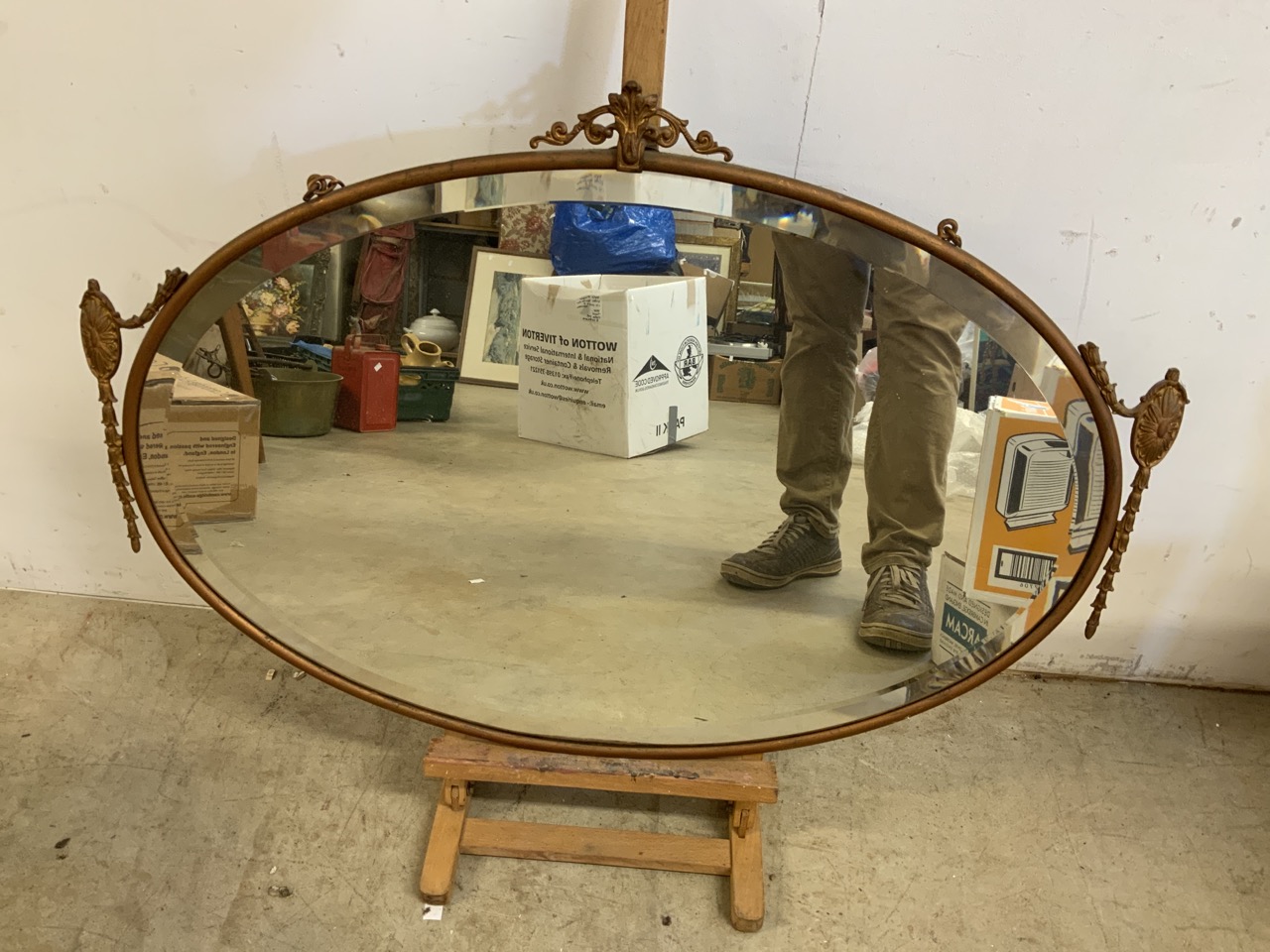 A mid century mirror in metal frame. W:82cm x H:57cm