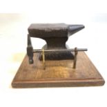 Antique miniature jewellers anvil and hammer on wooden plinth. W:21cm x D:16.5cm x H:12cm