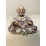 A 19th century porcelain Mandarin nodding hands and head figurine with blue factory anchor mark.