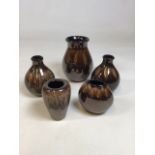 Five Poole Pottery vases in brown lustre glaze H:17cm largest