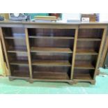 A 20th century break front bookcase with adjustable shelves with brass pegs. W:183cm x D:31cm x H: