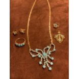 Gold coloured and turquoise jewellery. Includes earrings, necklace, ring and pendants